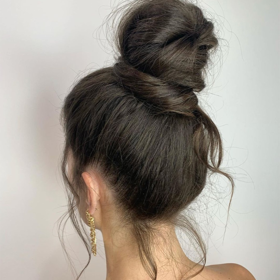 Image of a messy top knot hairstyle.